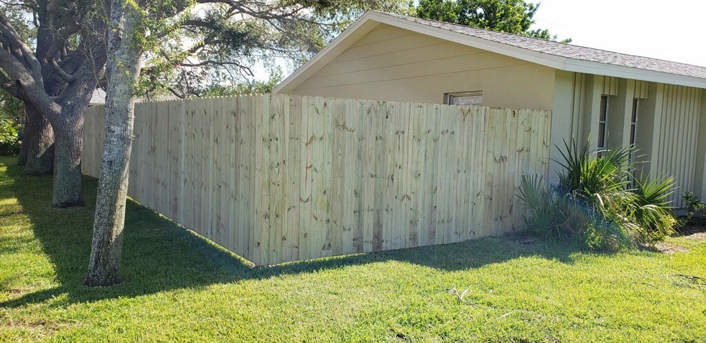 Wood fence beside a home from Carrie's Fence gallery